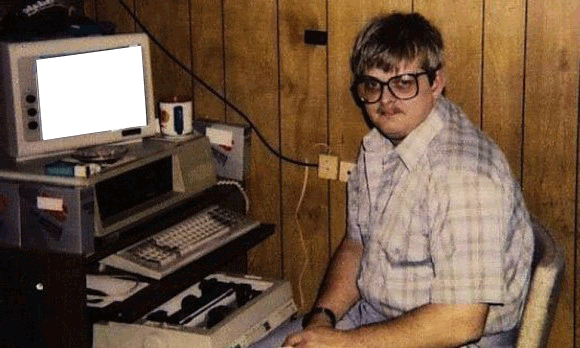 Old skool nerd with glasses and an old computer